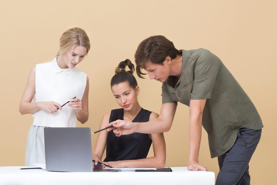 CFO explaining business performance data on a chart to a colleague
