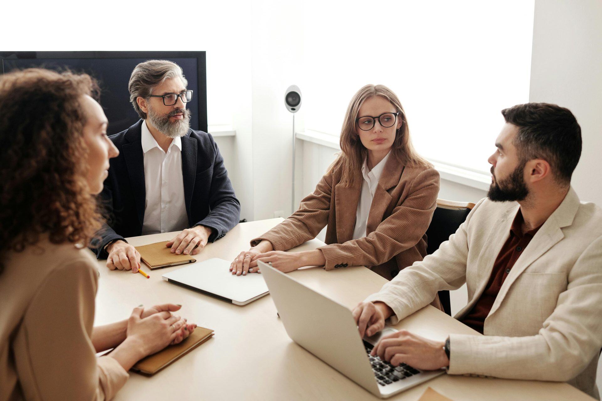 Fractional CFO in a boardroom meeting with a business owner and their team